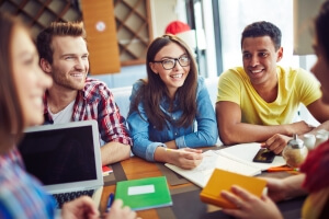 Group of Smiling students talking to each other symbolising education in Canada