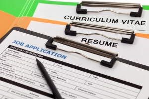Job application form, a resume and a curriculum vitae. Finding a job and Employment application. 