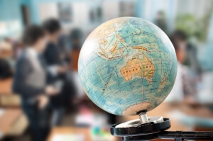 globe against the background of a school class