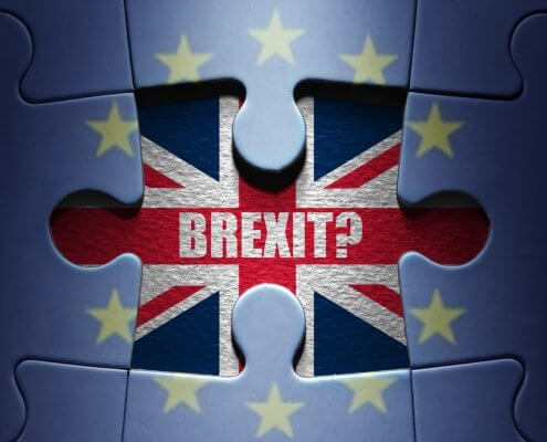 Missing piece from a European jigsaw puzzle revealing British flag and Brexit question symbolising emigrating after Brexit