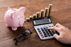 Person Calculating Savings to fund new business