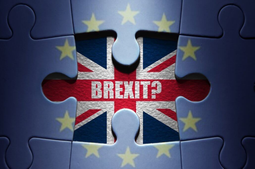 Missing piece from a European jigsaw puzzle revealing British flag and Brexit question. Brexit and UK art theme.