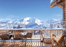 A house in the middle of the snow with a beautiful view of a mountain