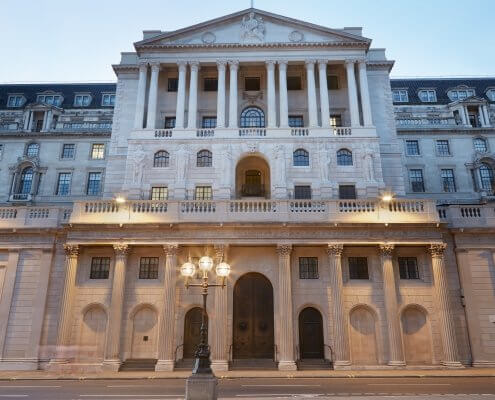 Bank of England facade in London in the evening. BoE UK interest rate cut concept