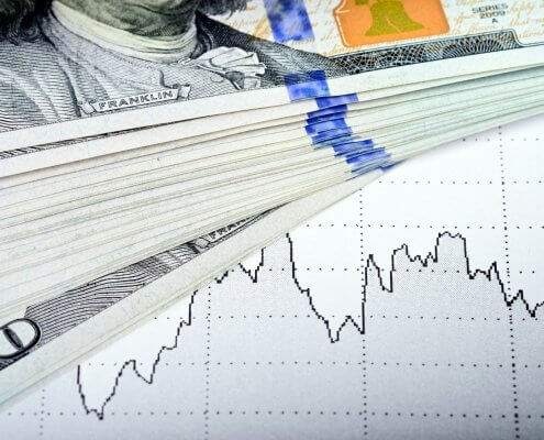 market chart and dollars banknote