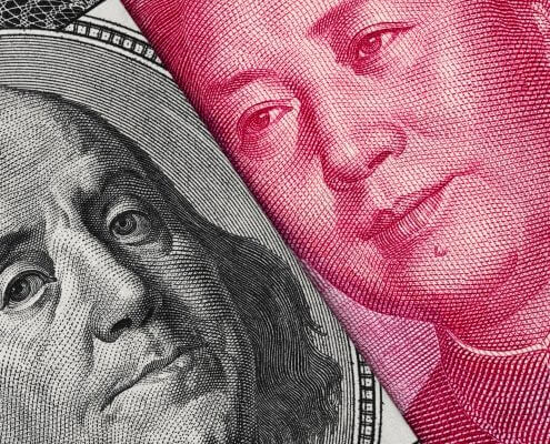 US Dollar and Chinese banknotes next to each other
