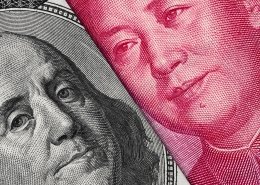 US Dollar bill and China yuan banknote macro, Chinese and US Dollar strengthened as Chinese workers try to get back to work