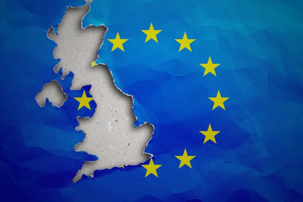 Piece in form of UK borders torn out from the flag of the European Union. United Kingdom withdrawal from the European Union. UK left the EU concept
