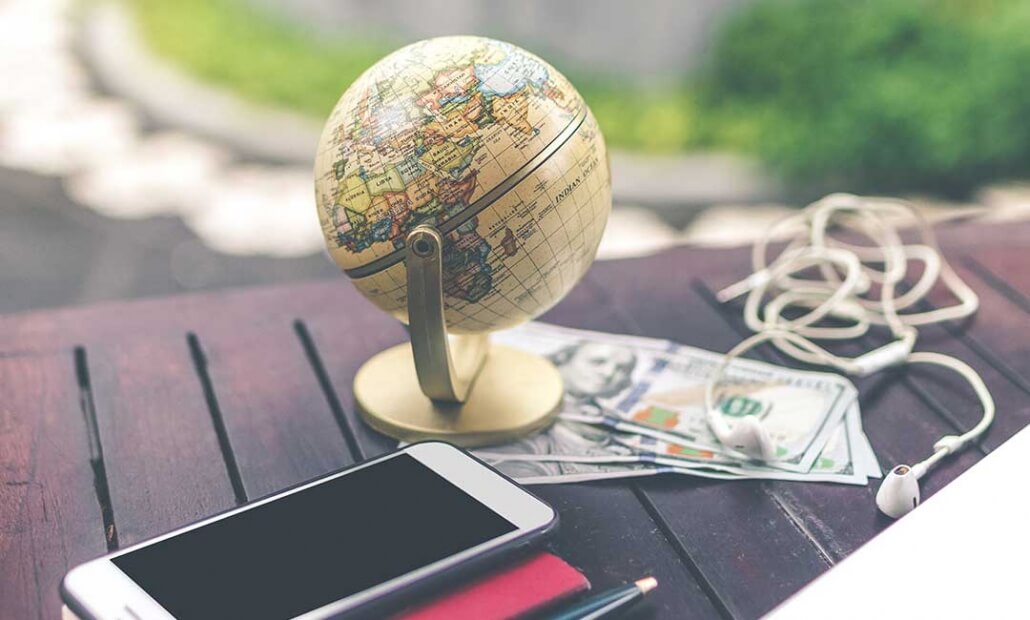 image of international globe and phone for currency transfers