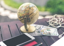 image of international globe and phone for currency transfers