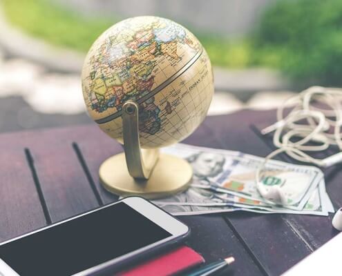 image of international globe and phone for currency transfers