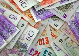 pile sterling notes sprawled out symbolising Sterling and UK economy