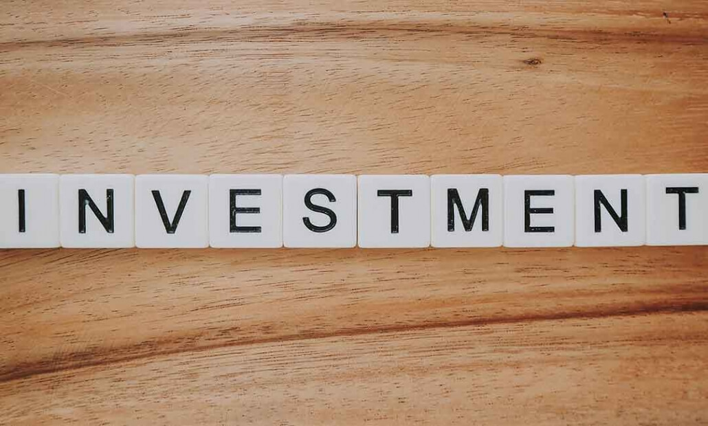 image of letters spelling investment. Concept of real estate investment in 2020