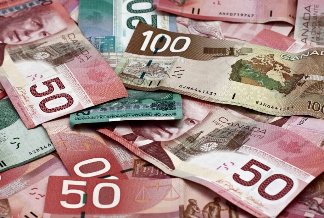 Canadian dollars sprawled around. GBP-CAD Quarter 2 forecast. UK and Canadian economy analysis in Quarter 2