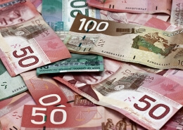 Canadian dollars sprawled around. GBP-CAD Quarter 2 forecast. UK and Canadian economy analysis in Quarter 2