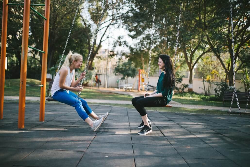 Friends Socialising in Park