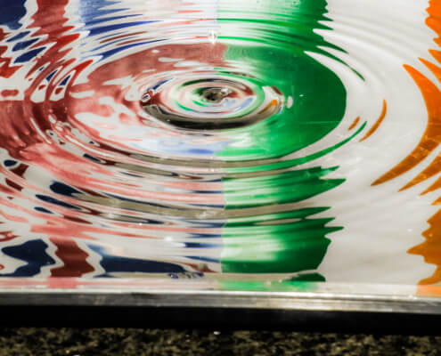 reflection of Italy and Britain flag in water