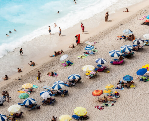 people enjoying on a beach in Britons