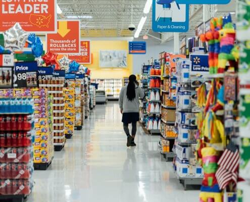 woman talking on phone in a supermarket