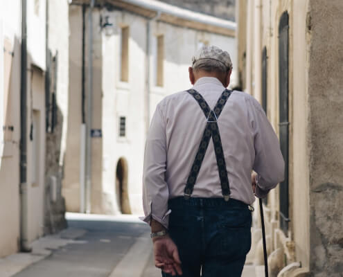 an old man running on the street