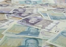 different pound currency notes spreading on table