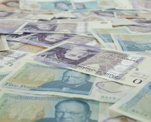 different pound currency notes spreading on table