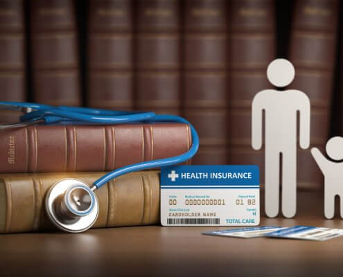 Medical health insurance concept. Family with stethoscope and plastic card.