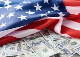 USA national flag and the dollar bills. Business and finance concept