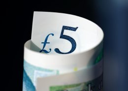 roll of five sterling pound note