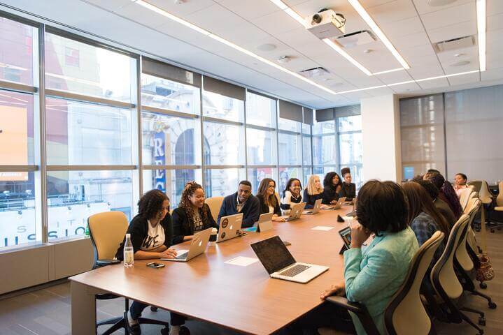 a group of people in a meeting