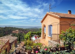 Roussillon village, garden and red house