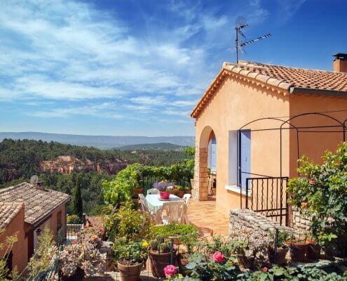 Roussillon village, garden and red house