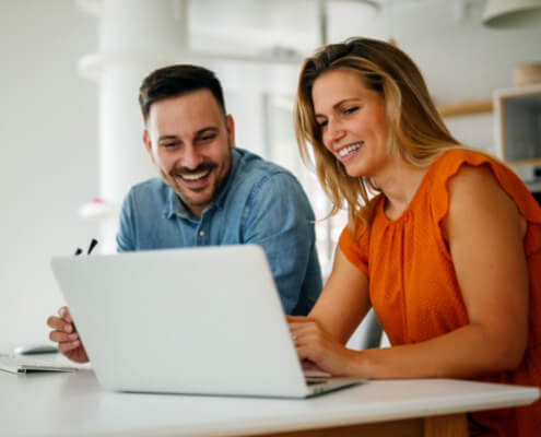 couple using laptop