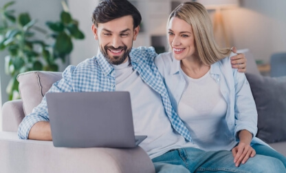 couple using laptop